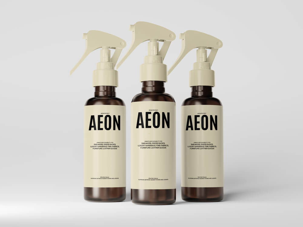 Three AEON ceramic coating bottles arranged in professional product display