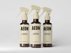 Three AEON ceramic coating bottles arranged in professional product display