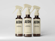 Three AEON ceramic coating bottles arranged in professional product display
