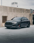 Rear view of an Audi coated with AEON Satin Paint Protection Film, showcasing the sleek and protective matte finish in an urban setting.