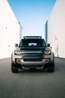 Frontal view of a Land Rover Defender with AEON Satin Paint Protection Film, highlighting the sleek and protective matte appearance.
