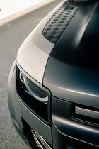 Close-up of the Land Rover Defender's hood protected by AEON Satin Paint Protection Film, illustrating a smooth, textured finish.